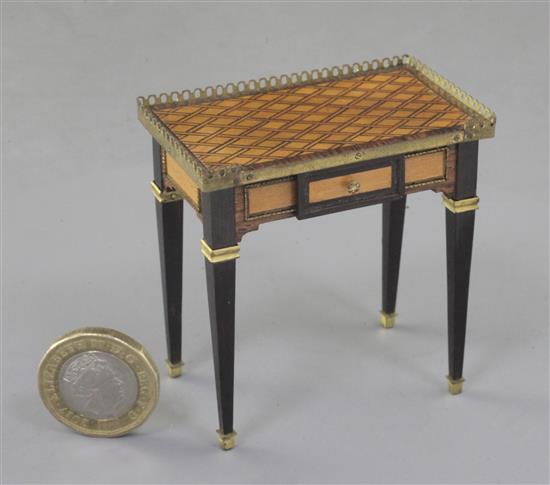 Denis Hillman. A Louis XVI style parquetry inlaid miniature table a ecrire, constructed of ten different woods, width 2.25in.
